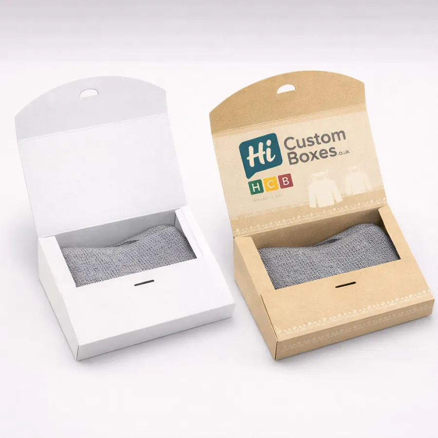 White and kraft gift boxes with a curved lid- featuring a window to see the jumper- class=